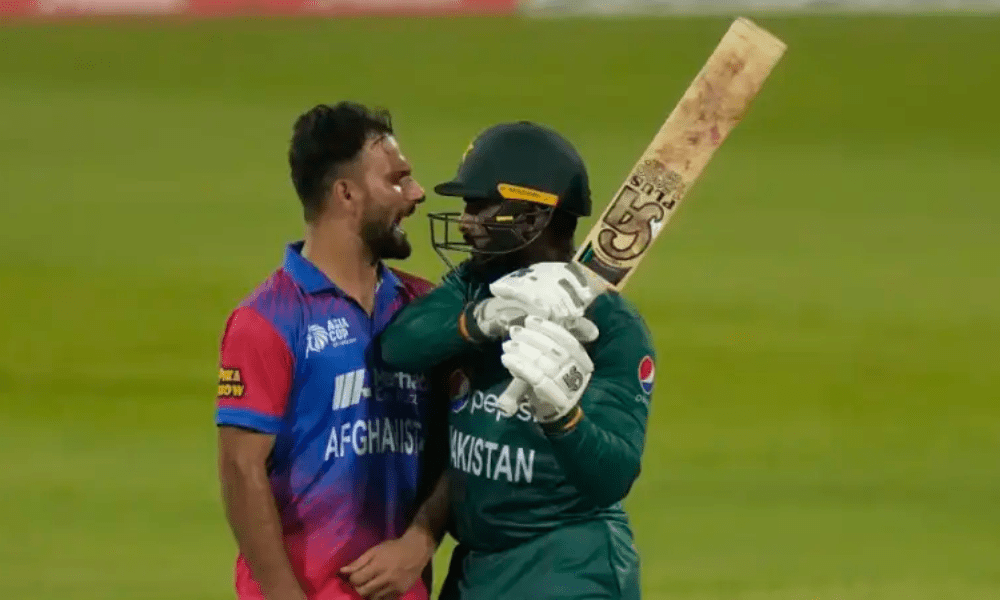 Pakistan's Asif Ali and Afghanistan's Fareed Ahmed fighting